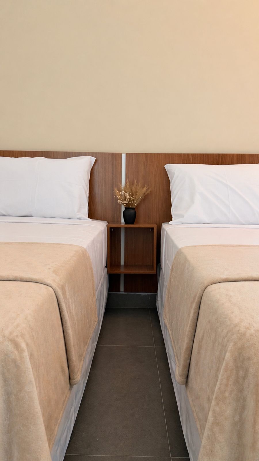 Camas do Quarto Quádruplo do Smart Hotel